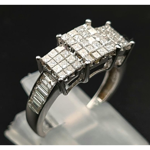 1017 - An 18K White Gold Princess-Cut Diamond Ring. Twenty brilliant white central diamonds with twelve dia... 