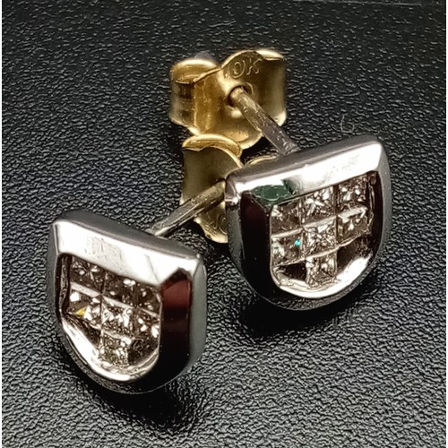 516 - A 14 K white gold, diamond (0.33 carats) set, shield shaped, stud earrings.  Total weight: 1.6 g.