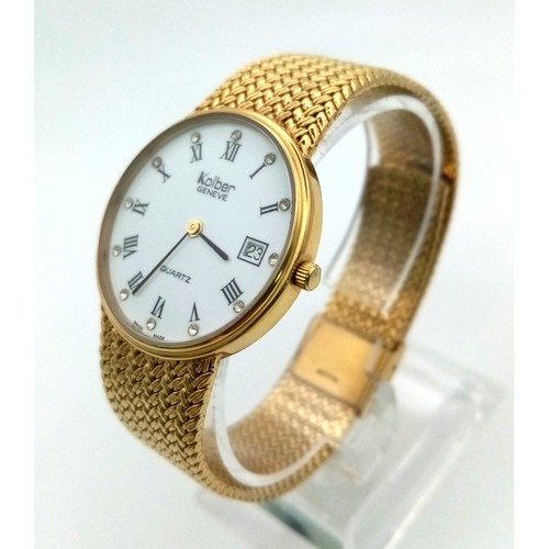 906 - A Kolber Geneve Gold Plated Quartz Gents Watch. Gold plated strap and case - 32mm. White dial with d... 