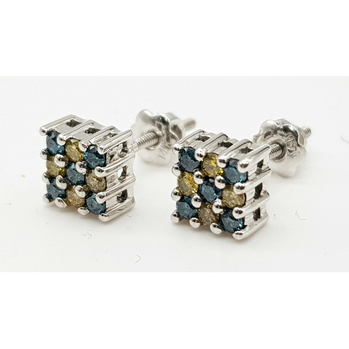 573 - A 14 K white gold square cluster stud earrings with yellow and blue diamonds 0.2 carats). Total weig... 