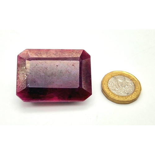 1135 - A 241ct Rectangular Step-Cut  Ruby Gemstone. Crystalline inclusions and Colour enhanced. GLI Certifi... 