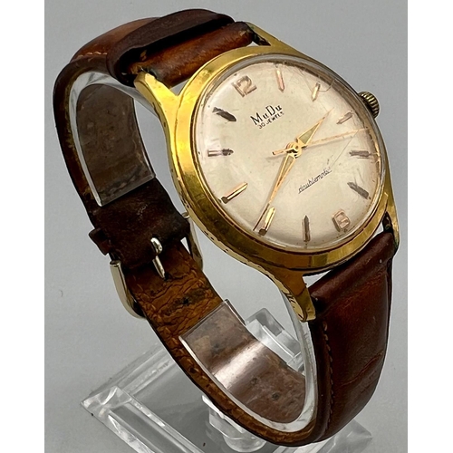 1100 - A Vintage Mudu Doublematic Gents Watch. Brown leather strap. Gilded case - 35mm. In working order.