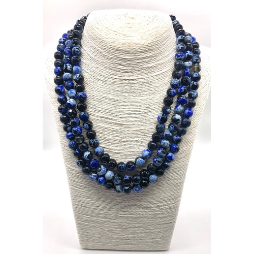 1058 - A Dragons Vein Shades of Blue Coloured Three-Row Agate Necklace. 10mm beads. 42-46cm.