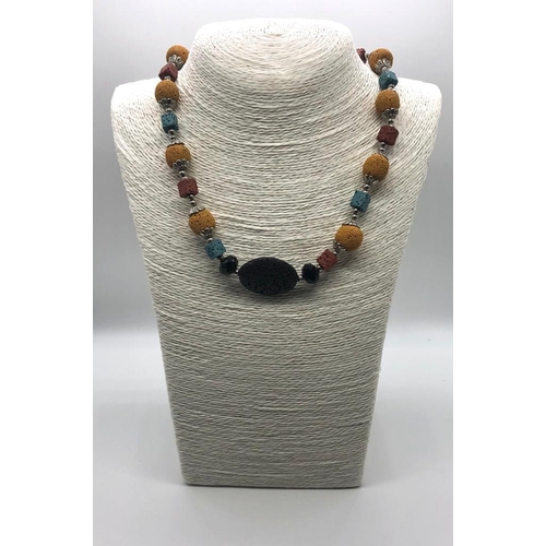 1079 - An Unusual Multi-Coloured Lava Stone Necklace. 46cm