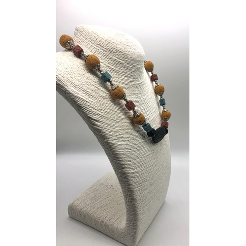 1079 - An Unusual Multi-Coloured Lava Stone Necklace. 46cm