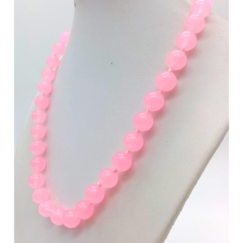 1167 - A Pink Jade Bead Necklace. 10mm beads. 42cm.