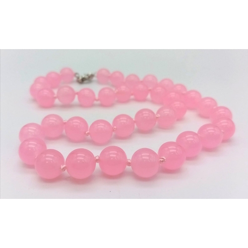 1167 - A Pink Jade Bead Necklace. 10mm beads. 42cm.