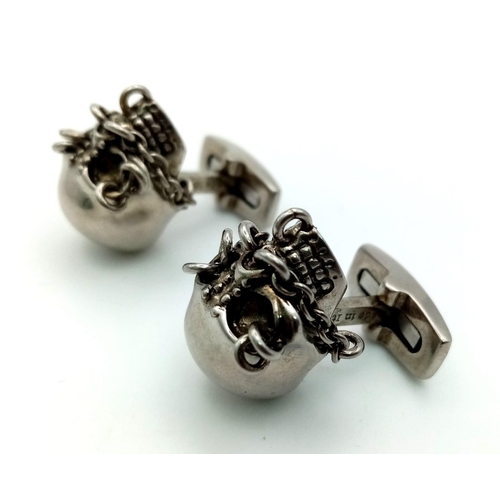 148 - An Iconic ALEXANDER MCQUENN sculls pair of cufflinks. In excellent condition with original travel cl... 