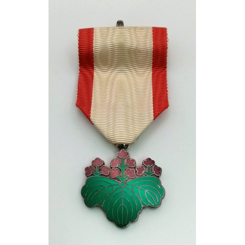 154 - A Japanese Order of The Rising Sun 7th Class Medal with Ribbon. Comes In original presentation case.