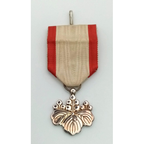 301 - A Japanese Order of The Rising Sun 8th Class Medal with Ribbon. In original presentation case.