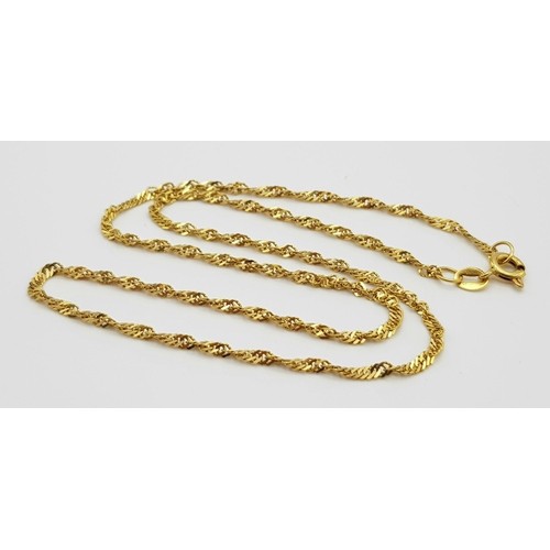 132 - A 20K Yellow Gold Necklace - 40cm and two pairs of 20k yellow gold earrings. Total weight - 6.8g. Re... 