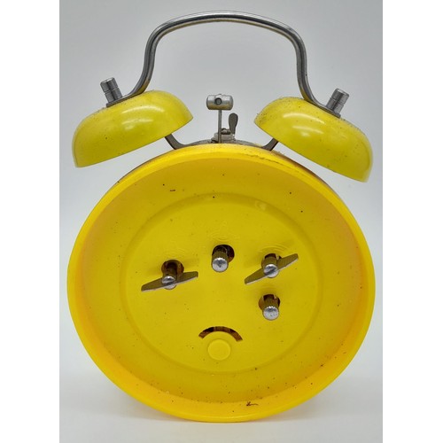 1243 - A VINTAGE YELLOW SMILEY FACE DOUBLE BELL ALARM CLOCK. HEIGHT18CM. IN WORKING ORDER.