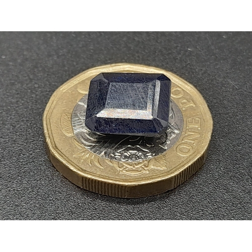 1383 - A 6.95ct Blue Sapphire - Rectangular shape. Comes with a certificate.