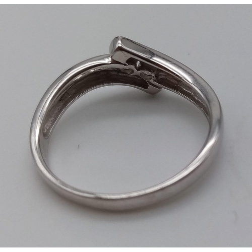 715 - A 9K White Gold Crossover Diamond Ring with 2 Diamonds in the center. Size O. Total weight: 2.66g