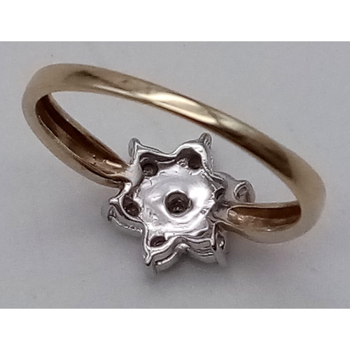 386 - A 9K Yellow Gold Diamond Ring in a Flower Shape. Size L. Total weight: 1.91g