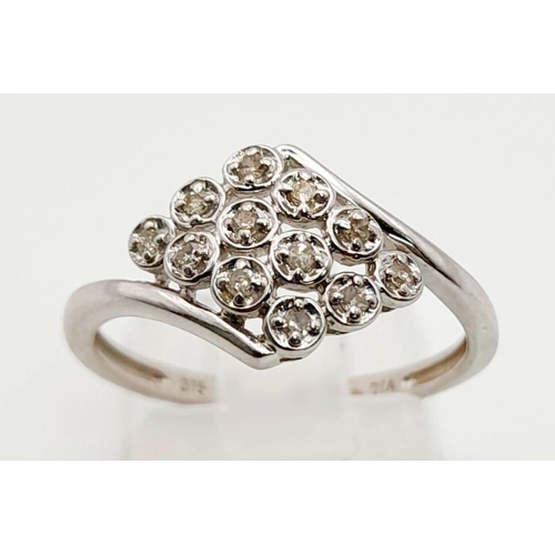 792 - A 9K White Gold 12 Diamonds Crossover Ring. Size O/P. Total weight: 2.20g