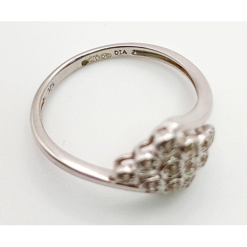 792 - A 9K White Gold 12 Diamonds Crossover Ring. Size O/P. Total weight: 2.20g