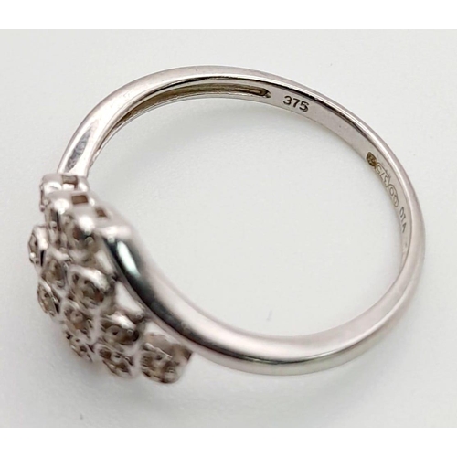 792 - A 9K White Gold 12 Diamonds Crossover Ring. Size O/P. Total weight: 2.20g