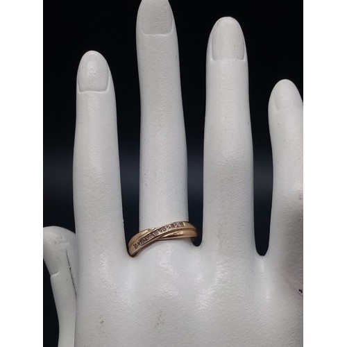 946 - A 9K Yellow Gold Crossover Diamond Band Ring. With a row of 7 diamonds. Size N. 
Total weight: 1.75g