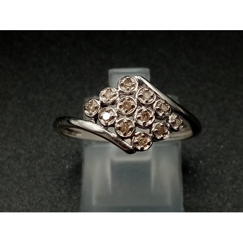 687 - A 9K White Gold 12 Diamonds Crossover Ring. Size S. Total weight: 2.14g