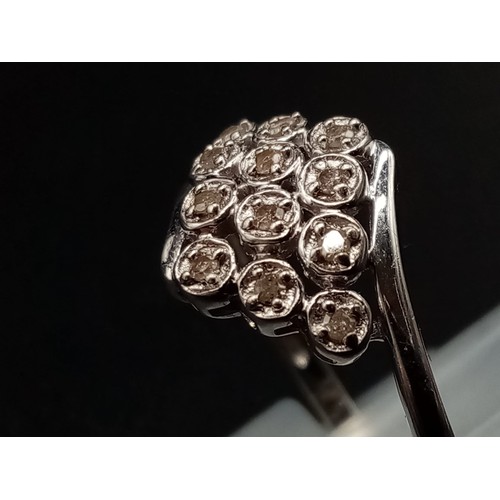 687 - A 9K White Gold 12 Diamonds Crossover Ring. Size S. Total weight: 2.14g