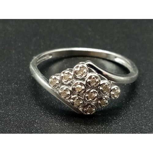 687 - A 9K White Gold 12 Diamonds Crossover Ring. Size S. Total weight: 2.14g