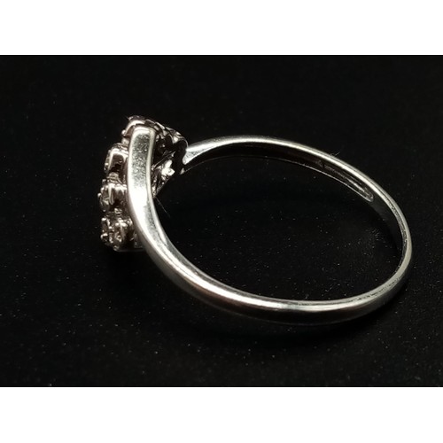 687 - A 9K White Gold 12 Diamonds Crossover Ring. Size S. Total weight: 2.14g