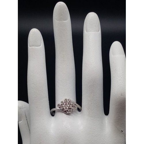 687 - A 9K White Gold 12 Diamonds Crossover Ring. Size S. Total weight: 2.14g