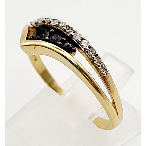 827 - A 9k Yellow Gold Chevron Black and White Diamonds Ring. Size S. Total weight: 2.38g