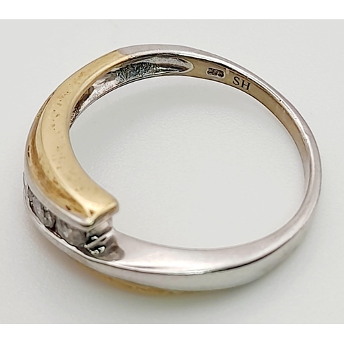 876 - A 9K White and Yellow Gold Crossover Ring with separated 3 Diamonds. Size N. Total weight: 2.50g