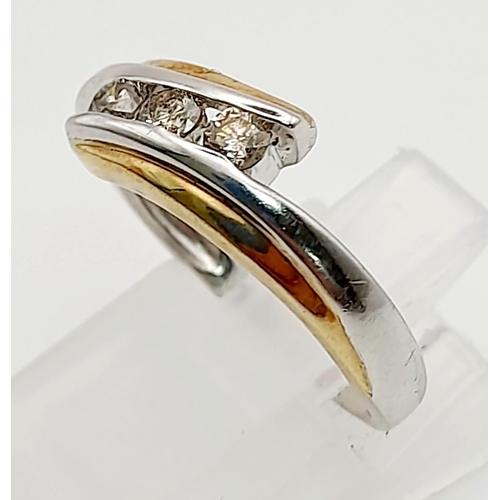 1368 - A 9K White and Yellow Gold Crossover Ring with 3 Separated diamonds. Size L/M. Total weight: 2.57g