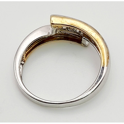 1368 - A 9K White and Yellow Gold Crossover Ring with 3 Separated diamonds. Size L/M. Total weight: 2.57g