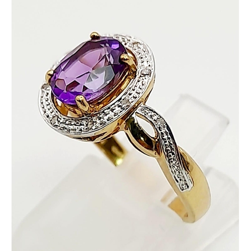 1231 - A 9K Yellow Gold Ring with a Centre Amethyst and Halo Diamonds surrounded by and on both shoulder. S... 