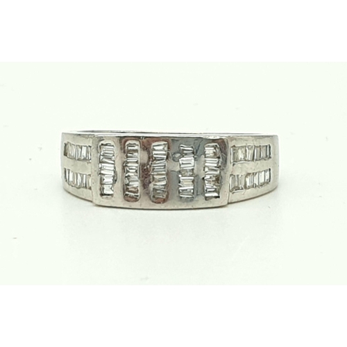 820 - An 18K White Gold Diamond Band Ring - Vertical and horizontal diamond bands. Size M. 5.63g