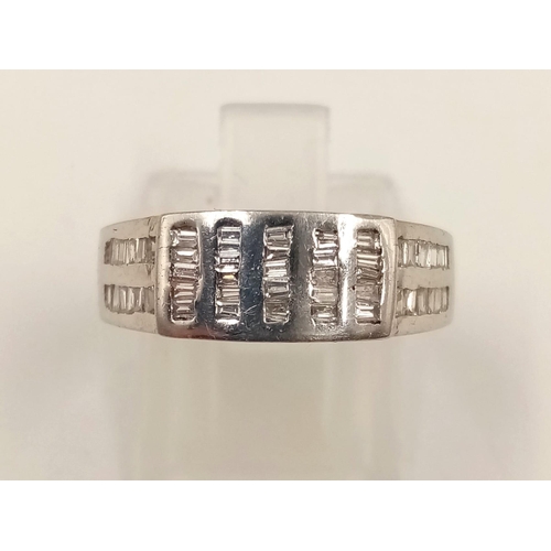 820 - An 18K White Gold Diamond Band Ring - Vertical and horizontal diamond bands. Size M. 5.63g