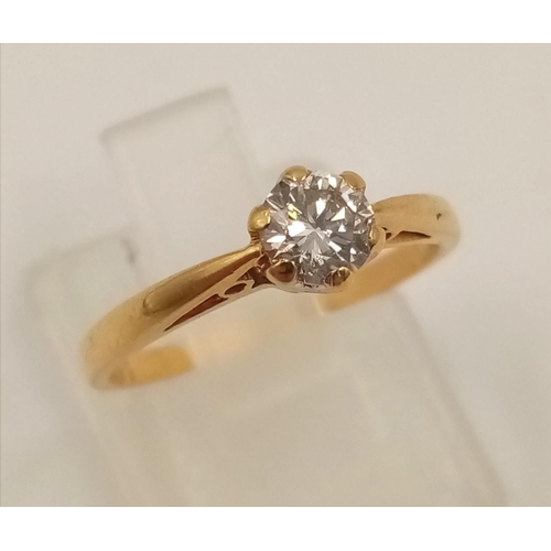 1031 - An 18K Yellow Gold Diamond Solitaire Ring. 0.35ct.
Size J. 1.82g.