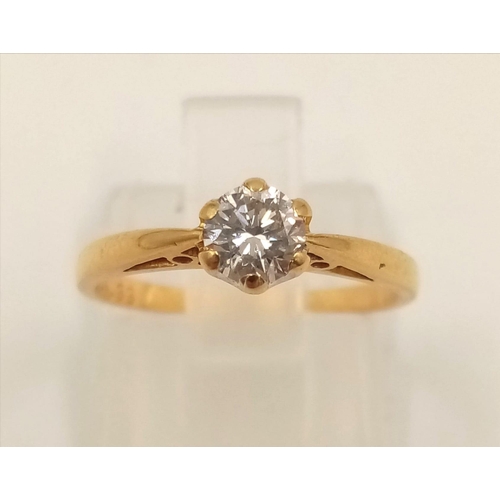 1031 - An 18K Yellow Gold Diamond Solitaire Ring. 0.35ct.
Size J. 1.82g.