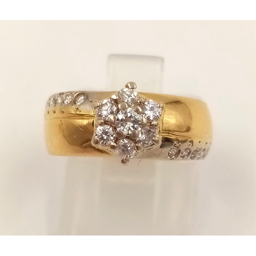 358 - An 18K Yellow Gold Diamond Cluster Ring. Star-shaped central diamond with diamond tail offshoots. Si... 