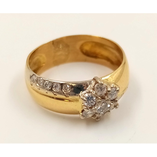 358 - An 18K Yellow Gold Diamond Cluster Ring. Star-shaped central diamond with diamond tail offshoots. Si... 