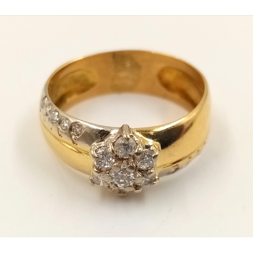 358 - An 18K Yellow Gold Diamond Cluster Ring. Star-shaped central diamond with diamond tail offshoots. Si... 