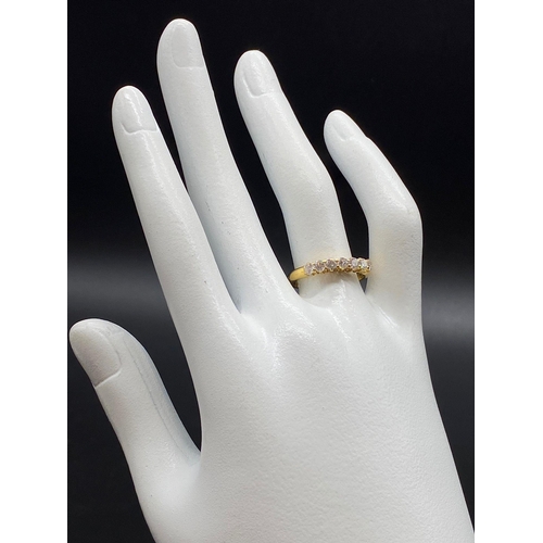 365 - An 18K Yellow Gold Seven-Stone Diamond Ring. 0.5ct.
Size O. 3g.