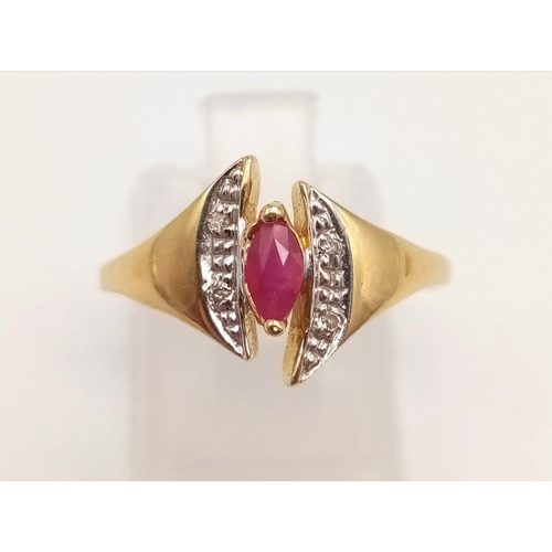 1073 - An 18K Yellow Gold Ruby and Diamond Ring. Marquise shaped centre ruby with diamond wings. Size N.
2g... 