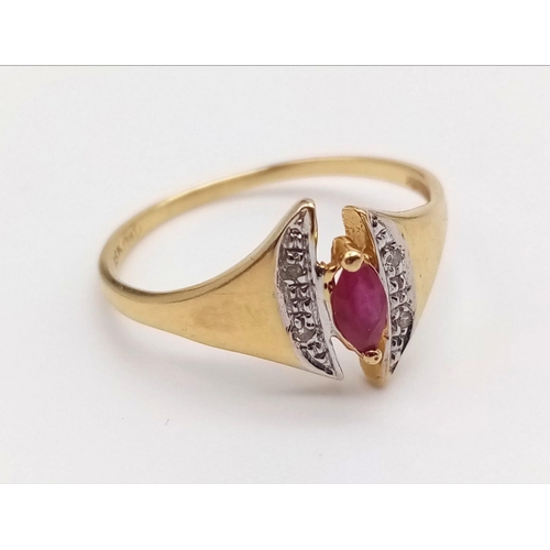 1073 - An 18K Yellow Gold Ruby and Diamond Ring. Marquise shaped centre ruby with diamond wings. Size N.
2g... 