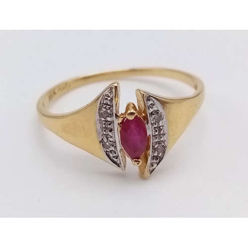 1073 - An 18K Yellow Gold Ruby and Diamond Ring. Marquise shaped centre ruby with diamond wings. Size N.
2g... 