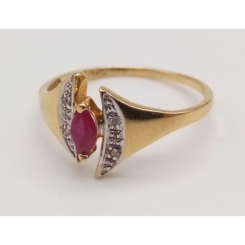 1073 - An 18K Yellow Gold Ruby and Diamond Ring. Marquise shaped centre ruby with diamond wings. Size N.
2g... 