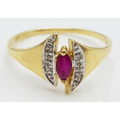 1073 - An 18K Yellow Gold Ruby and Diamond Ring. Marquise shaped centre ruby with diamond wings. Size N.
2g... 