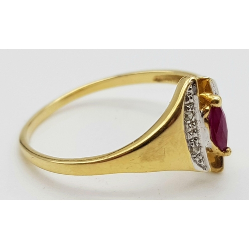 1073 - An 18K Yellow Gold Ruby and Diamond Ring. Marquise shaped centre ruby with diamond wings. Size N.
2g... 