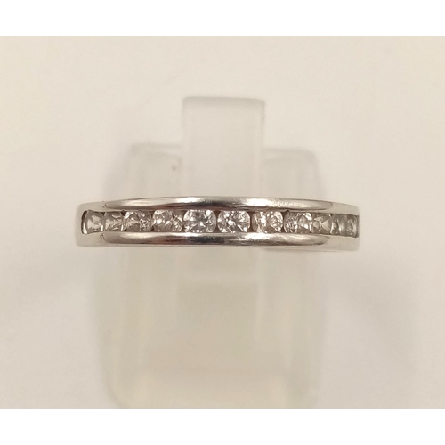 982 - An 18K White Gold Diamond Half-Eternity Ring. Size R.
2.23g