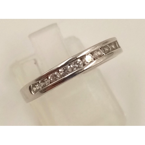 982 - An 18K White Gold Diamond Half-Eternity Ring. Size R.
2.23g