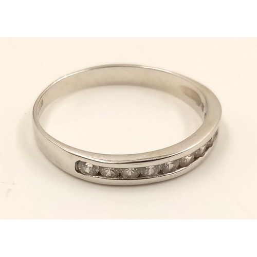 982 - An 18K White Gold Diamond Half-Eternity Ring. Size R.
2.23g